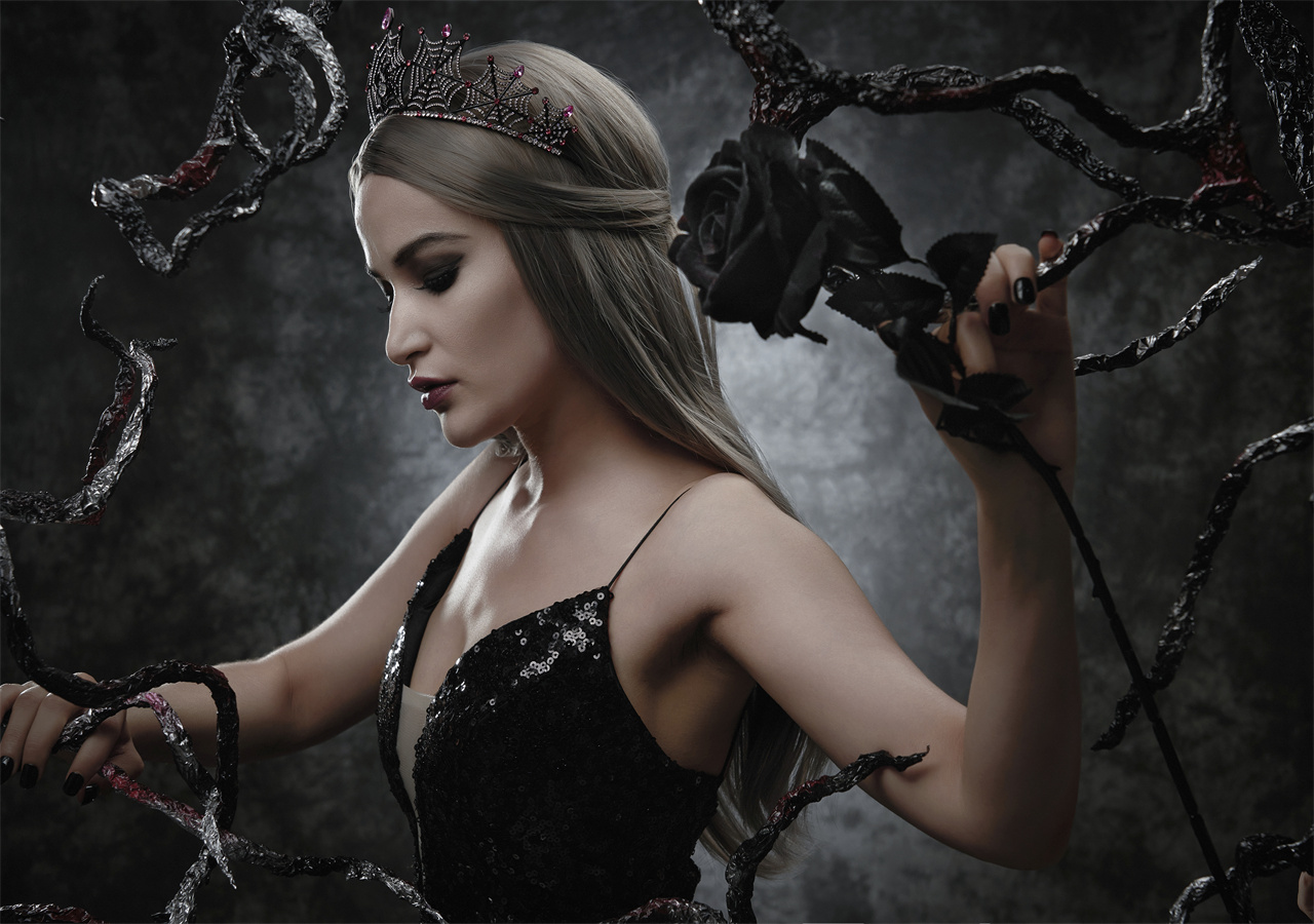 A beautiful woman is wearing a black dress and cast a spell.