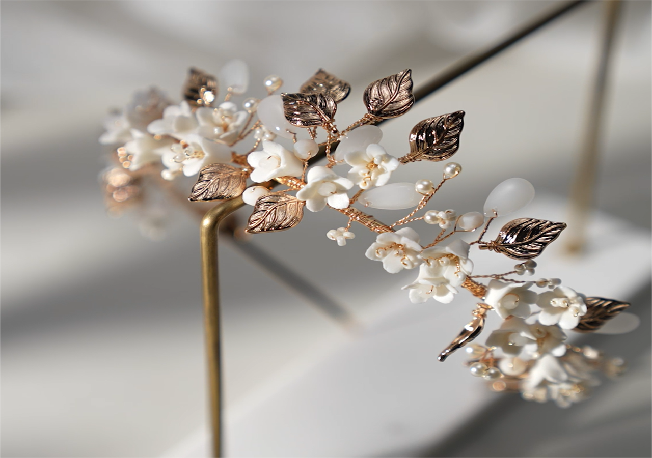 A beautiful Sweetv wedding tiara is hanging on the shelf, glittering under sunlight.