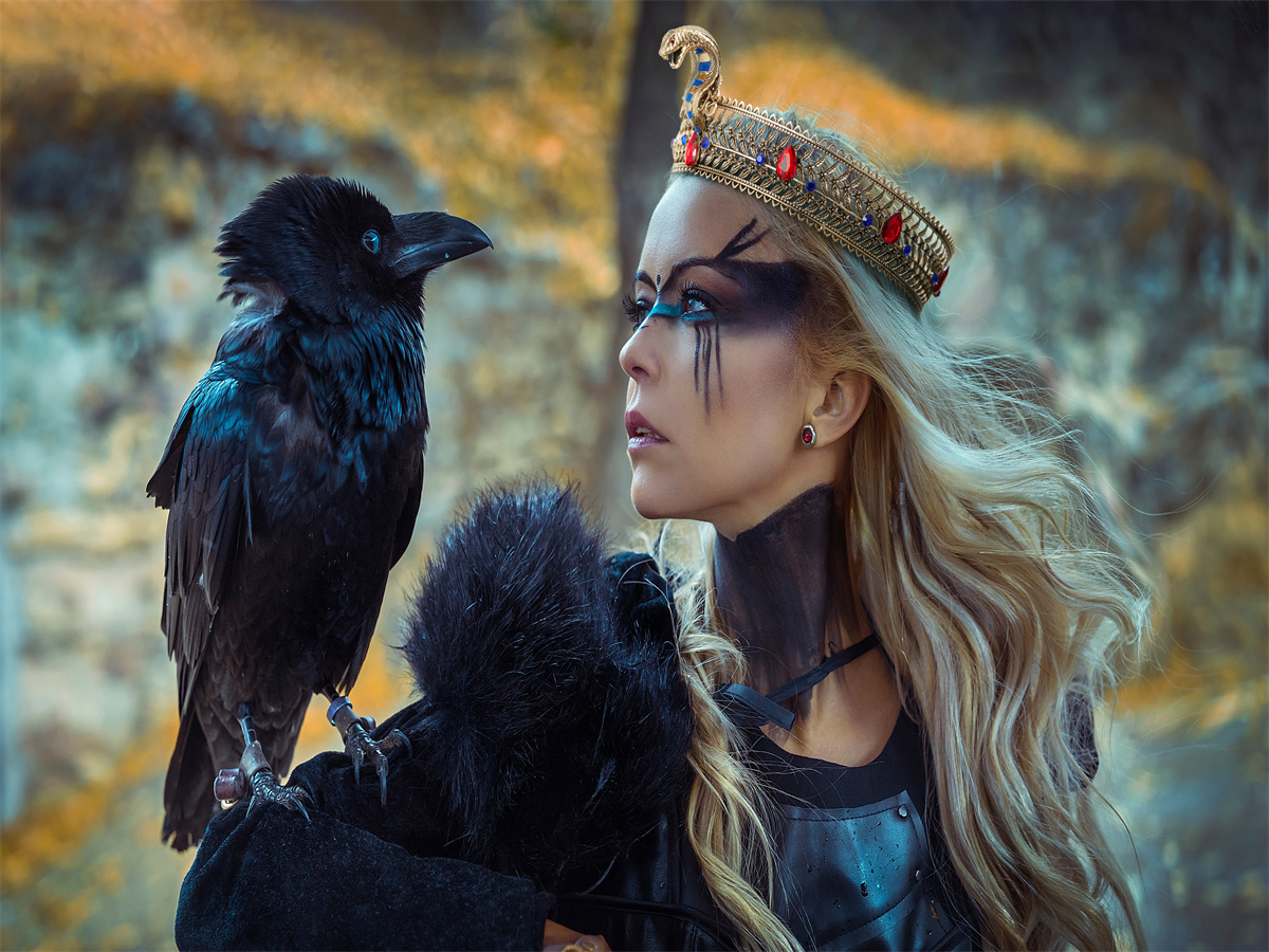 A queen wearing a snake crown looks out over her territory